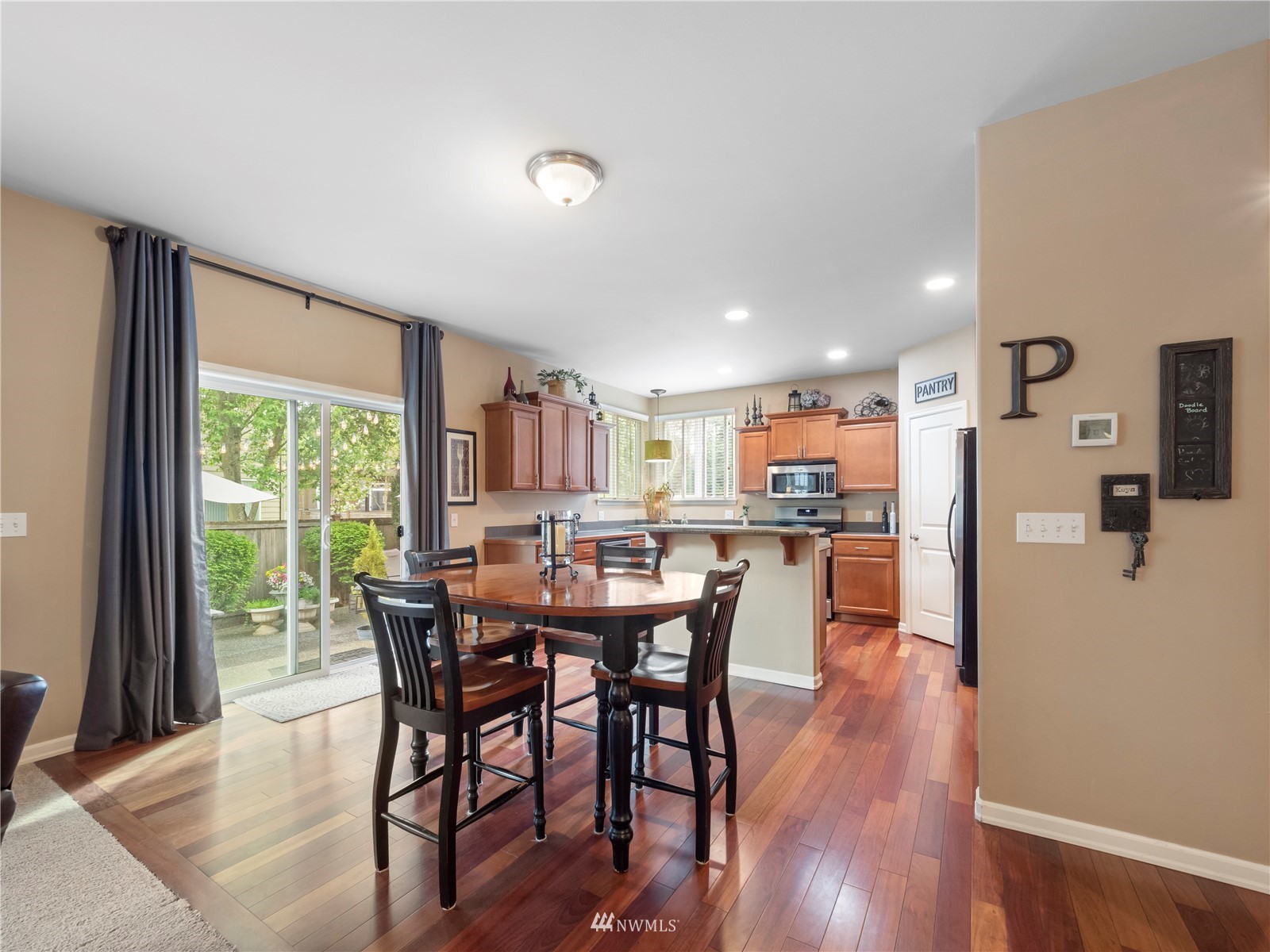 16529 37th Drive Southeast Bothell, WA 98012 - Photo 11 of 40 a view of a dining room with furniture and a floor to ceiling window
