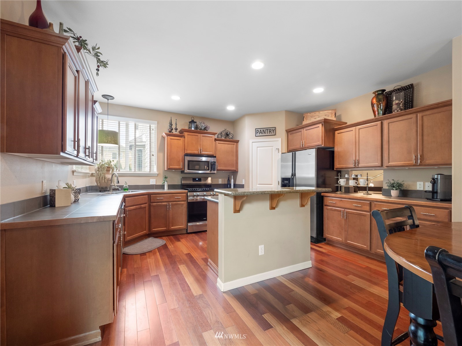 16529 37th Drive Southeast Bothell, WA 98012 - Photo 15 of 40 a kitchen with granite countertop a sink cabinets and stainless steel appliances
