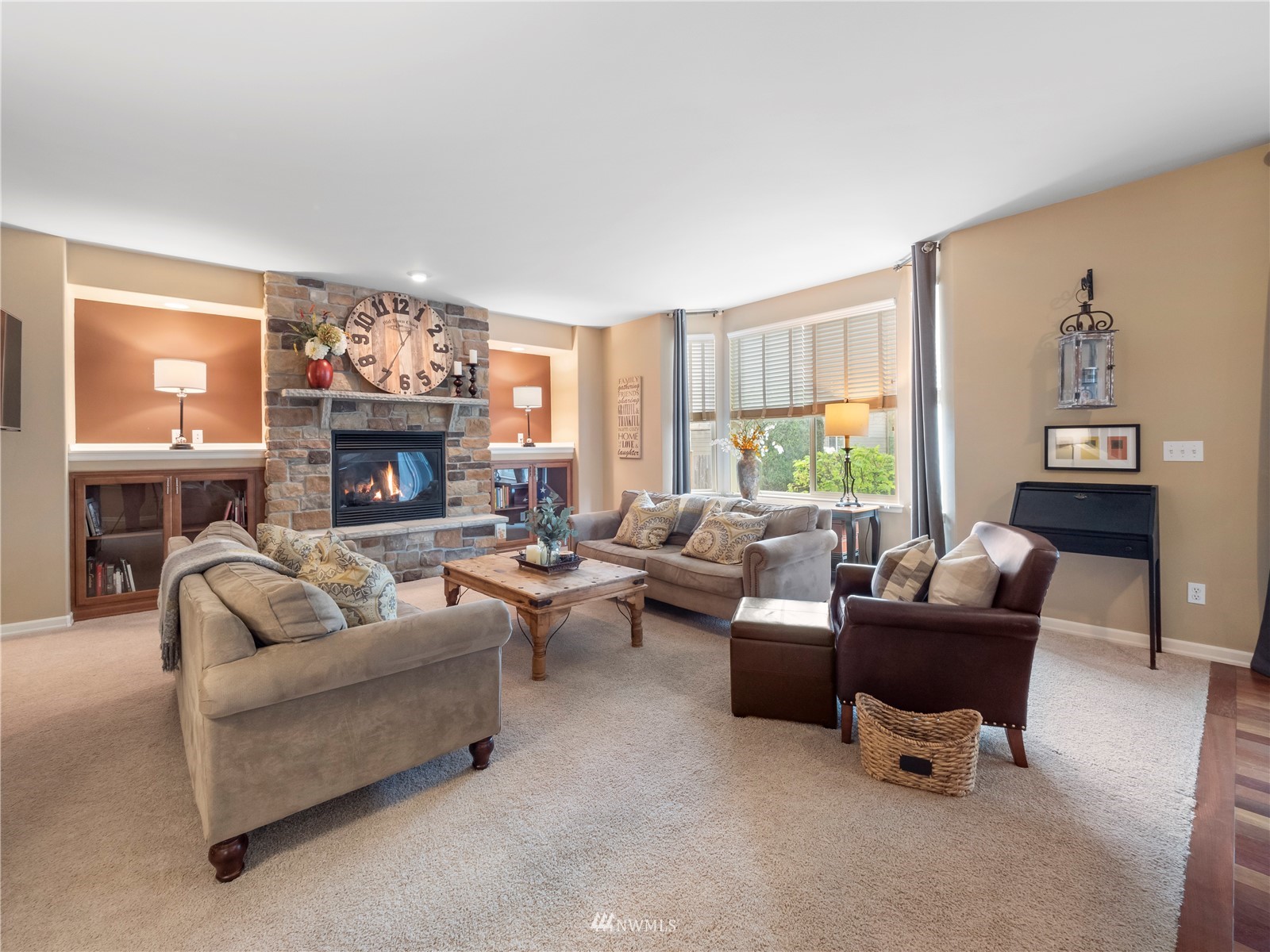 16529 37th Drive Southeast Bothell, WA 98012 - Photo 17 of 40 a living room with furniture a fireplace and a flat screen tv