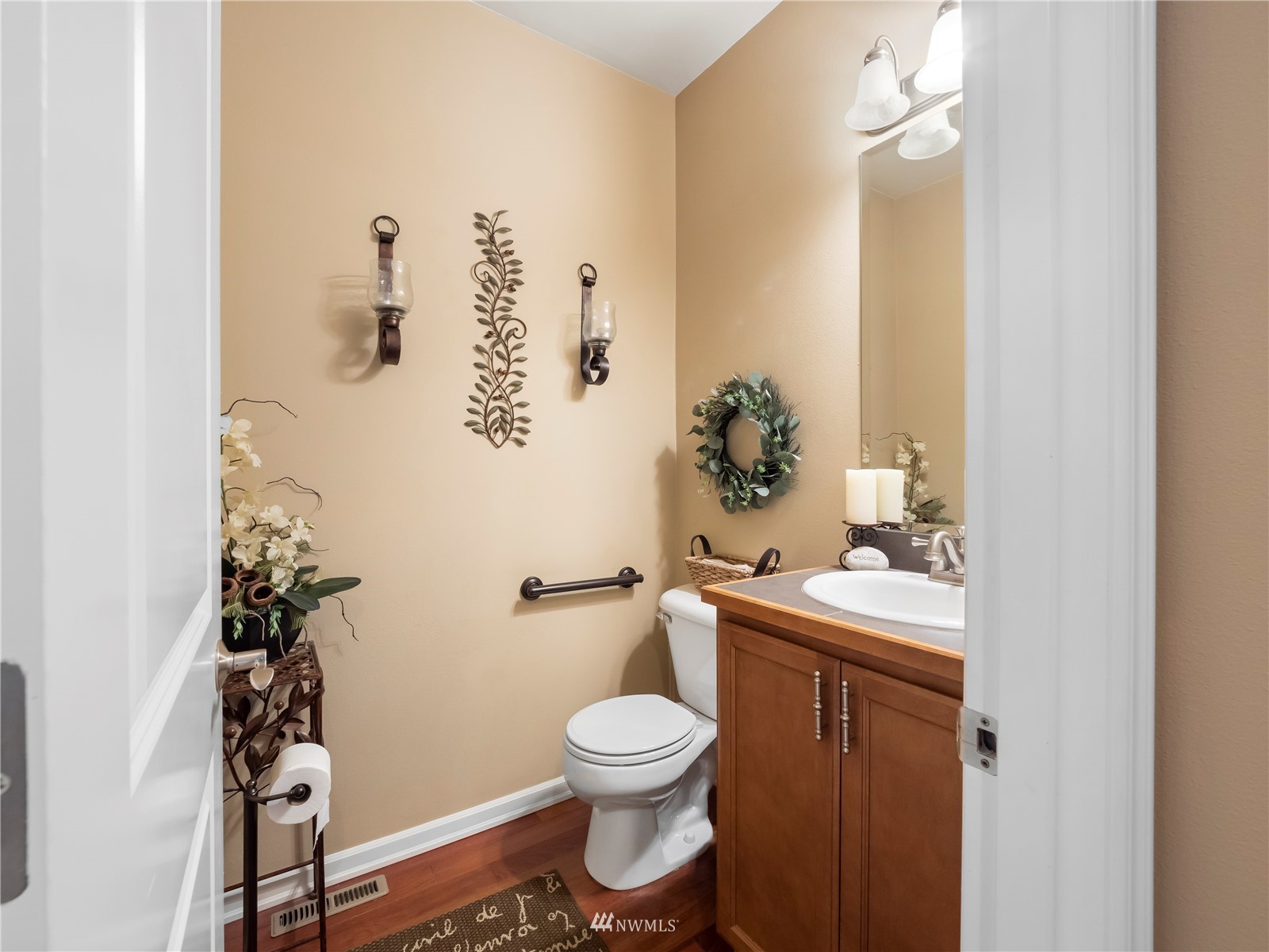 16529 37th Drive Southeast Bothell, WA 98012 - Photo 18 of 40 a bathroom with a toilet a sink and mirror