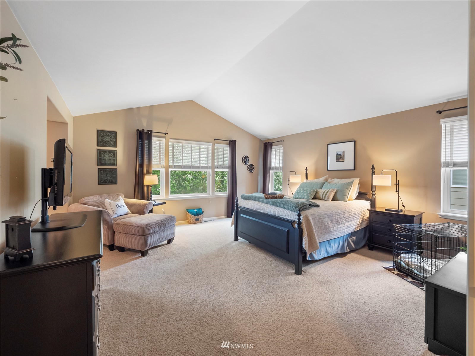 16529 37th Drive Southeast Bothell, WA 98012 - Photo 22 of 40 a bedroom with a large bed couch and a large window