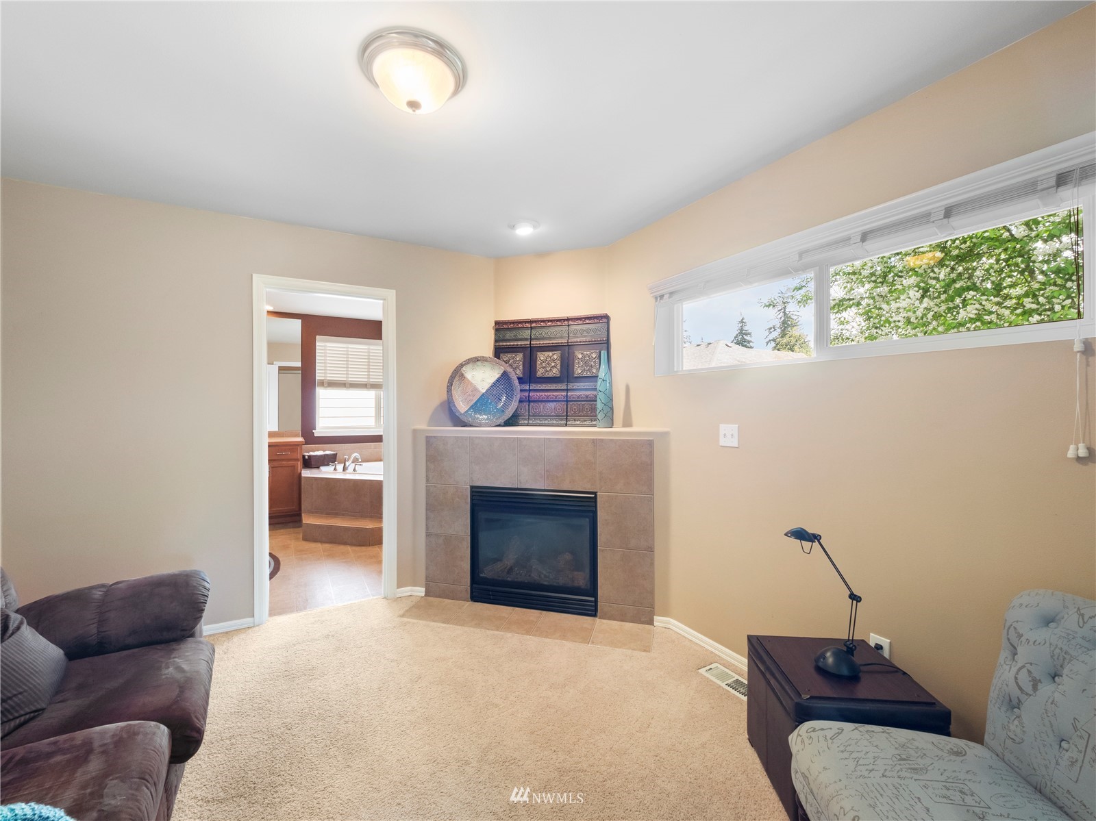 16529 37th Drive Southeast Bothell, WA 98012 - Photo 25 of 40 a living room with furniture and a fireplace