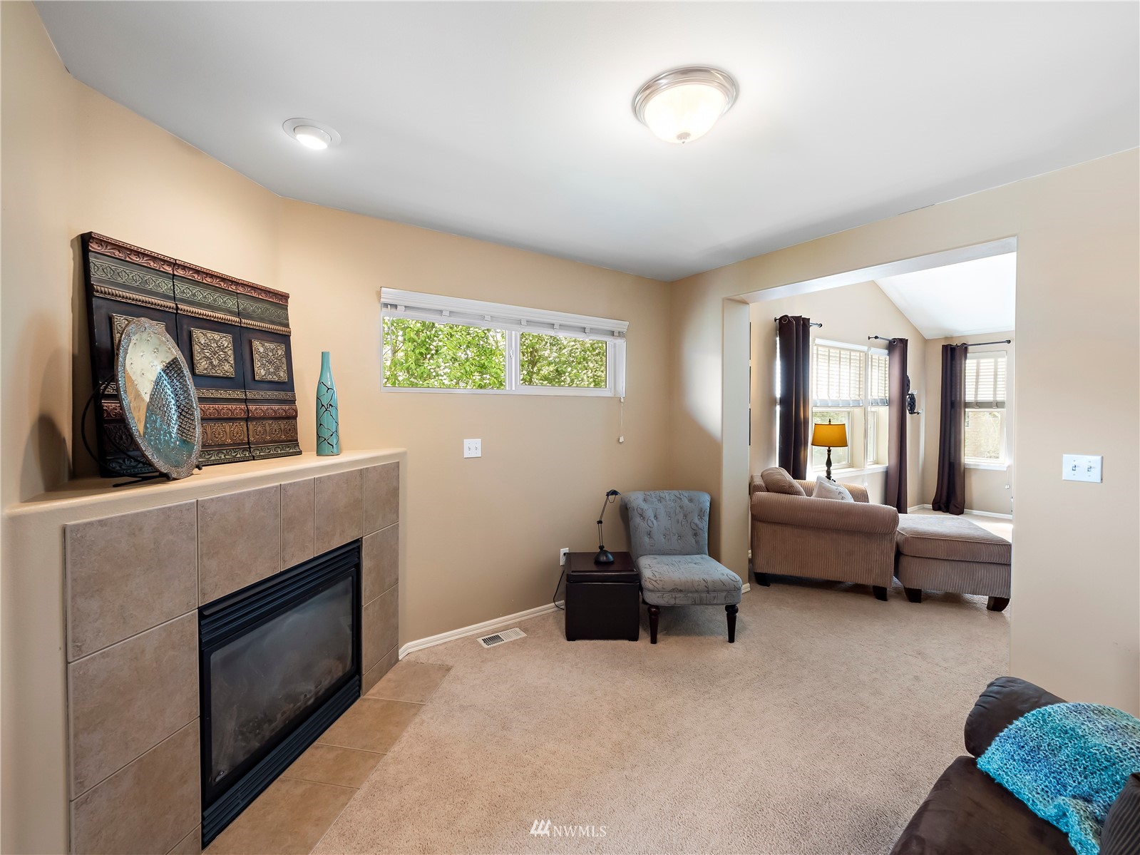 16529 37th Drive Southeast Bothell, WA 98012 - Photo 26 of 40 a living room with furniture and a fireplace