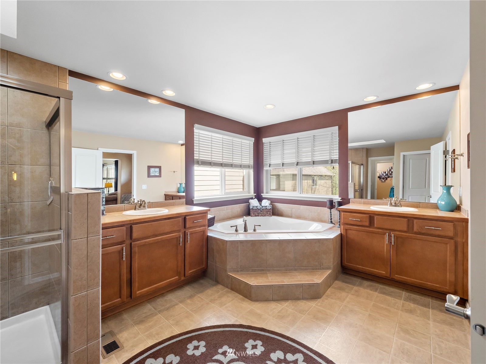 16529 37th Drive Southeast Bothell, WA 98012 - Photo 28 of 40 a spacious bathroom with a granite countertop tub sink and mirror
