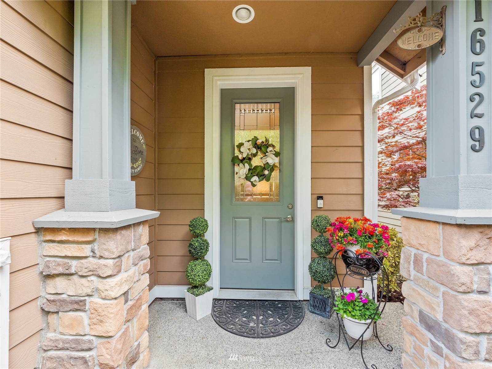 16529 37th Drive Southeast Bothell, WA 98012 - Photo 3 of 40 a front view of a house with outdoor seating