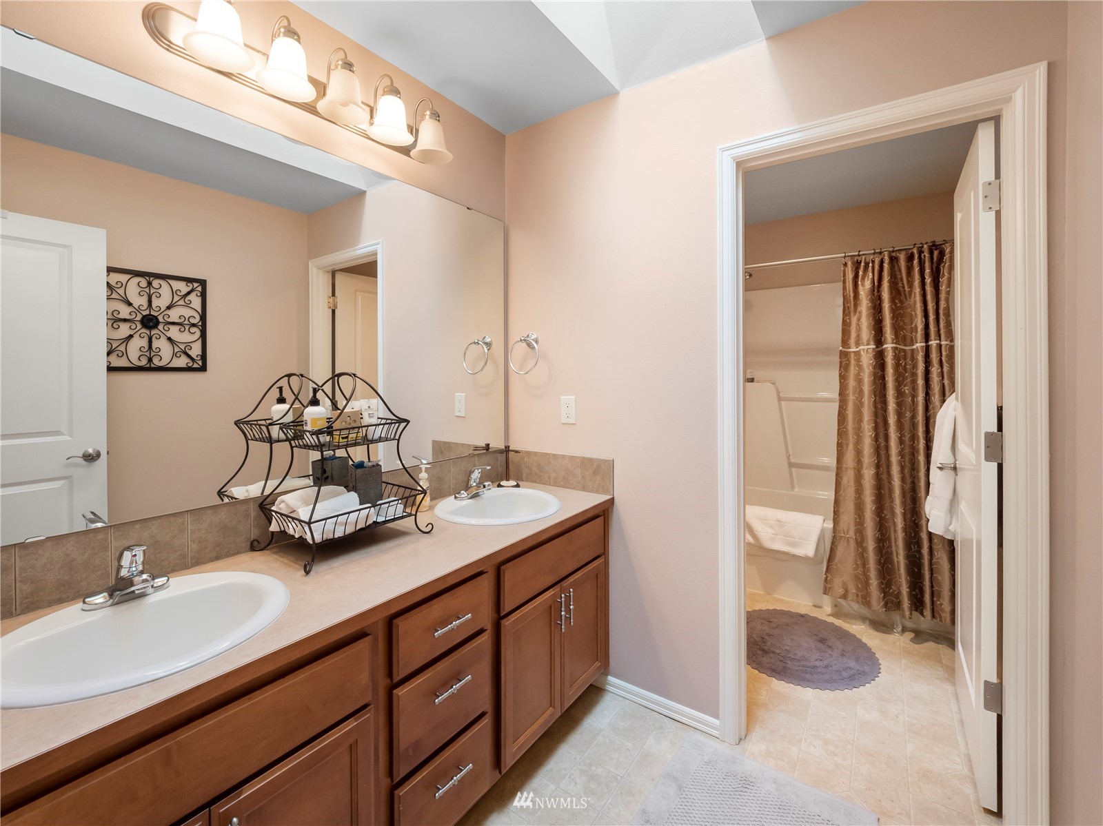 16529 37th Drive Southeast Bothell, WA 98012 - Photo 31 of 40 a bathroom with a sink and a mirror