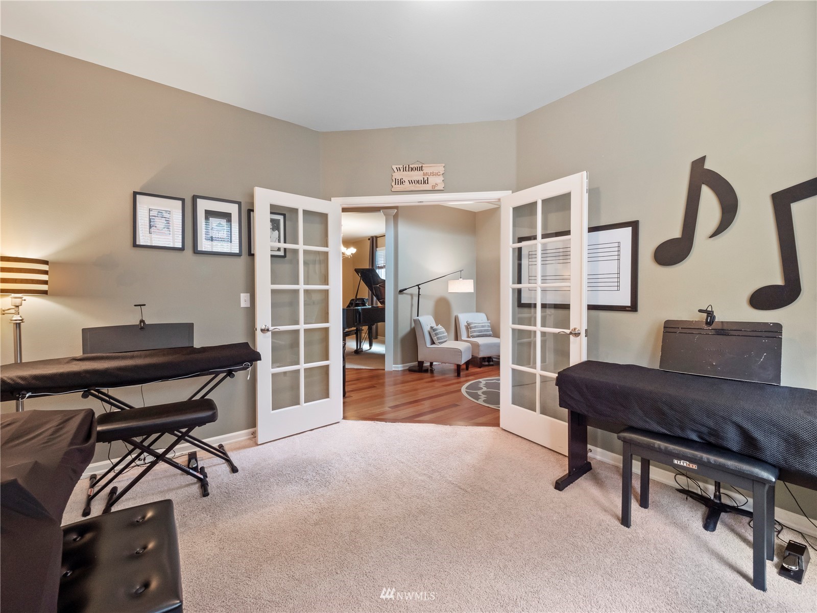 16529 37th Drive Southeast Bothell, WA 98012 - Photo 7 of 40 a living room with furniture and a piano