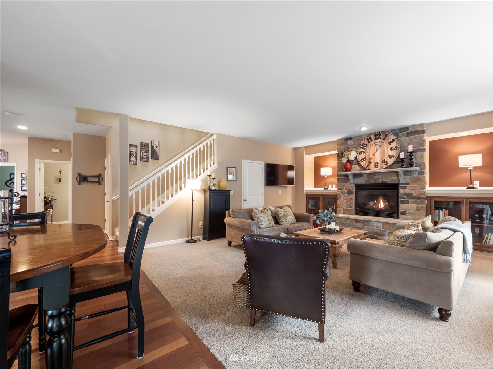 16529 37th Drive Southeast Bothell, WA 98012 - Photo 10 of 40 a living room with furniture a fireplace and a flat screen tv