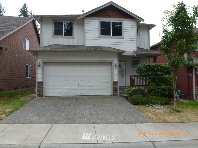 4120 150th Street Southeast Bothell, WA 98012 - Photo 1 of 16 a front view of a house with garage