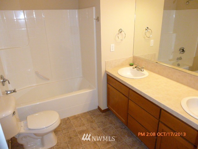 4120 150th Street Southeast Bothell, WA 98012 - Photo 14 of 16 a bathroom with a sink toilet and shower