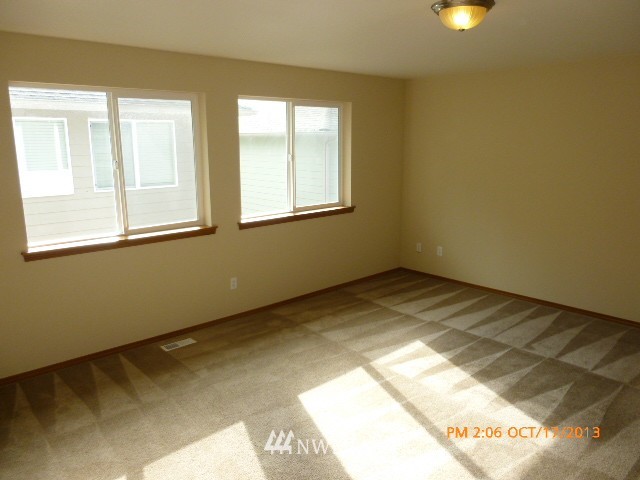 4120 150th Street Southeast Bothell, WA 98012 - Photo 7 of 16 a view of an empty room with a window