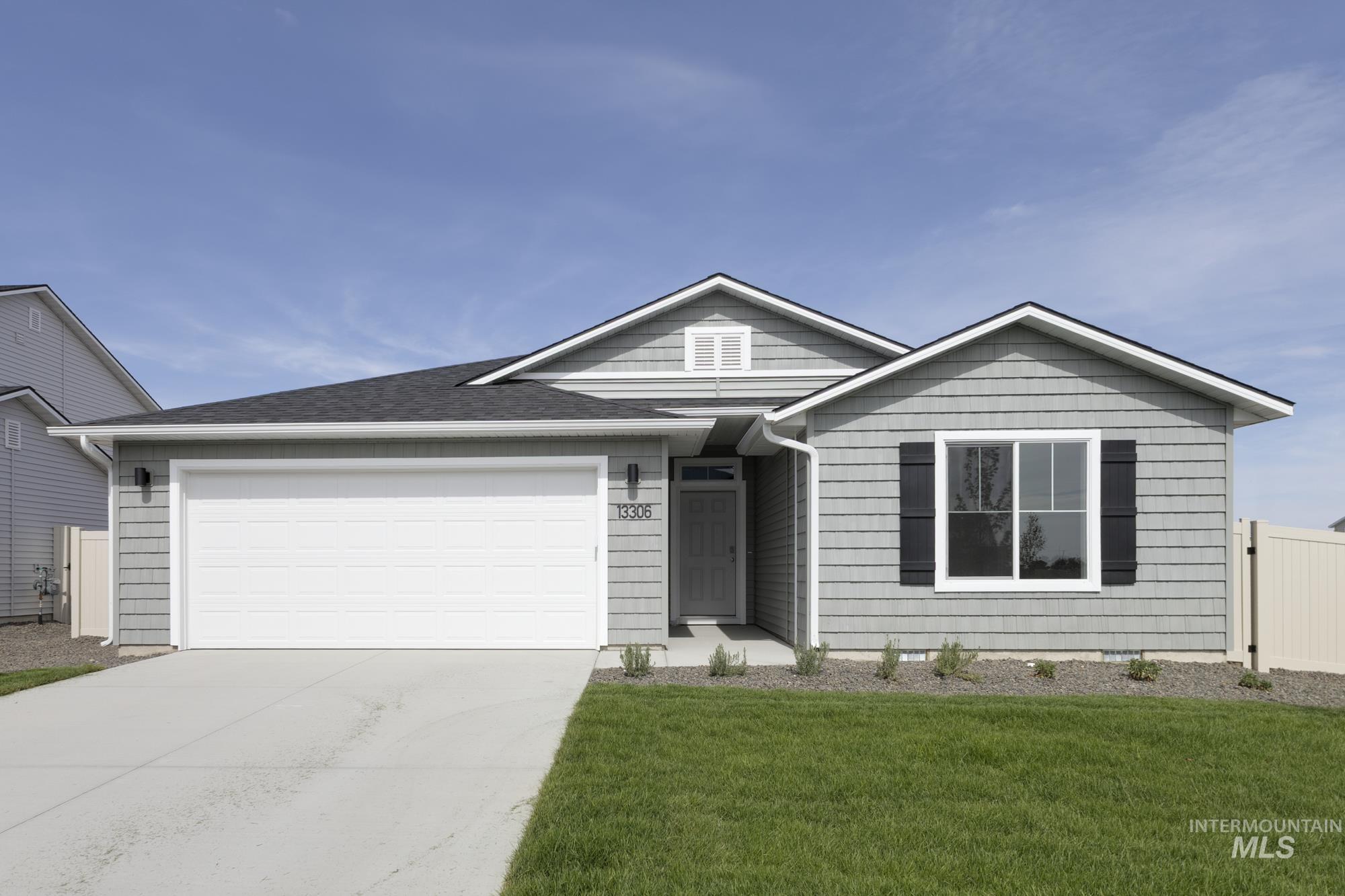 13306 Cut Street Caldwell, ID 83607 - Photo 1 of 1 Single story home with driveway, a garage, and a shingled roof