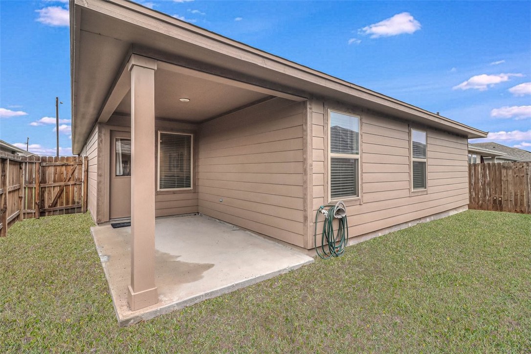 2321 Tranquil Lane Corpus Christi, TX 78418 - Photo 40 of 40 a view of a house with backyard and garage
