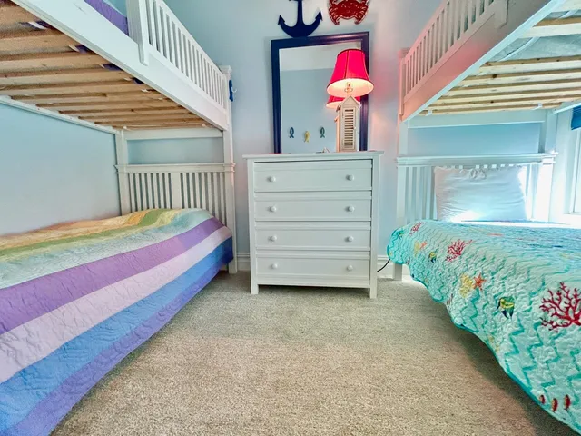 a bedroom with a bed and a dresser