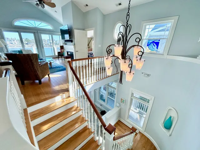 a view of an entryway with wooden floor