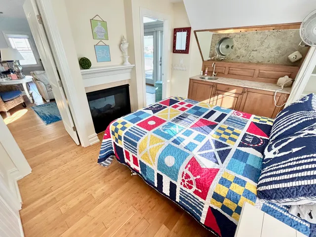 a bedroom with a bed and a fireplace