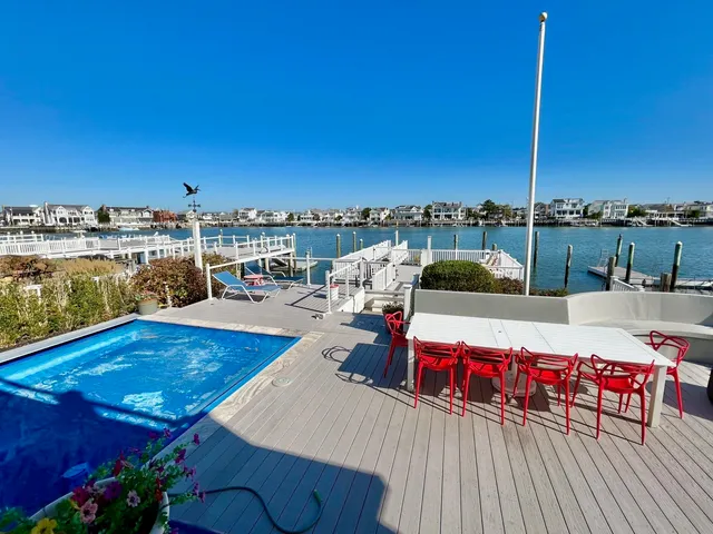 an aerial view of a house with a lake view