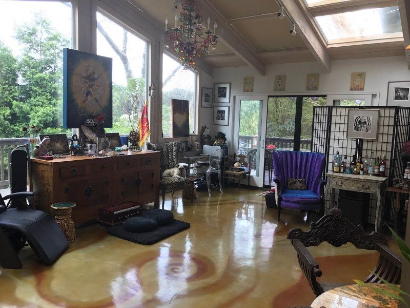 141 Kapuai Road Haiku, HI 96708 - Photo 4 of 15 a living room with furniture fireplace and a large window