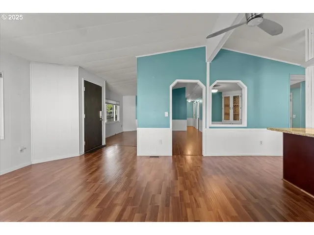 a kitchen with stainless steel appliances granite countertop a sink and a refrigerator