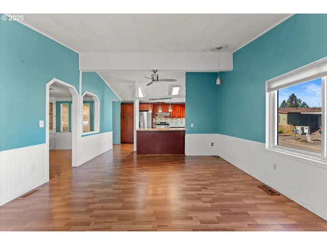 a kitchen with stainless steel appliances kitchen island granite countertop a sink and cabinets