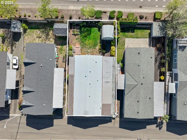 an aerial view of a house with a garden