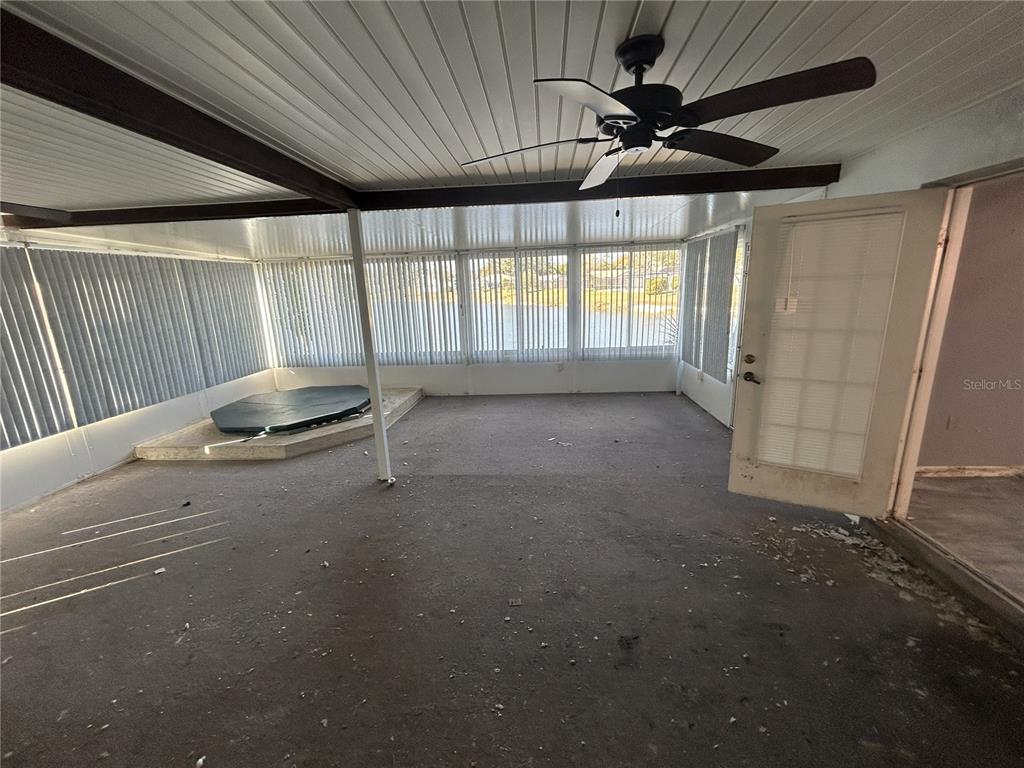 8807 Heather Boulevard Weeki Wachee, FL 34613 - Photo 5 of 7 a room with a ceiling fan and window