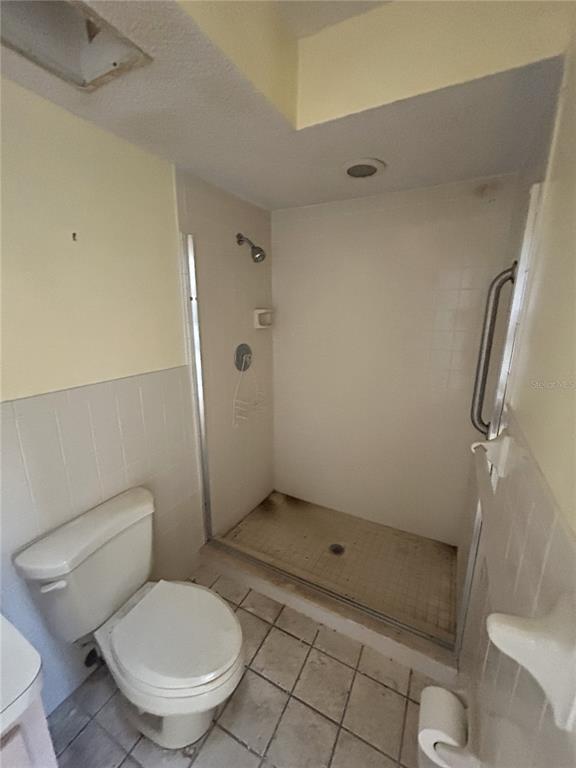 8807 Heather Boulevard Weeki Wachee, FL 34613 - Photo 6 of 7 a bathroom with a toilet and a shower