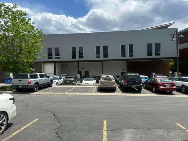 a picture of a bathroom with a shower and a sink