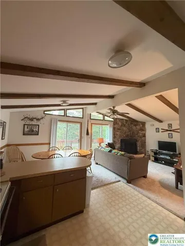 a room with furniture and a flat screen tv