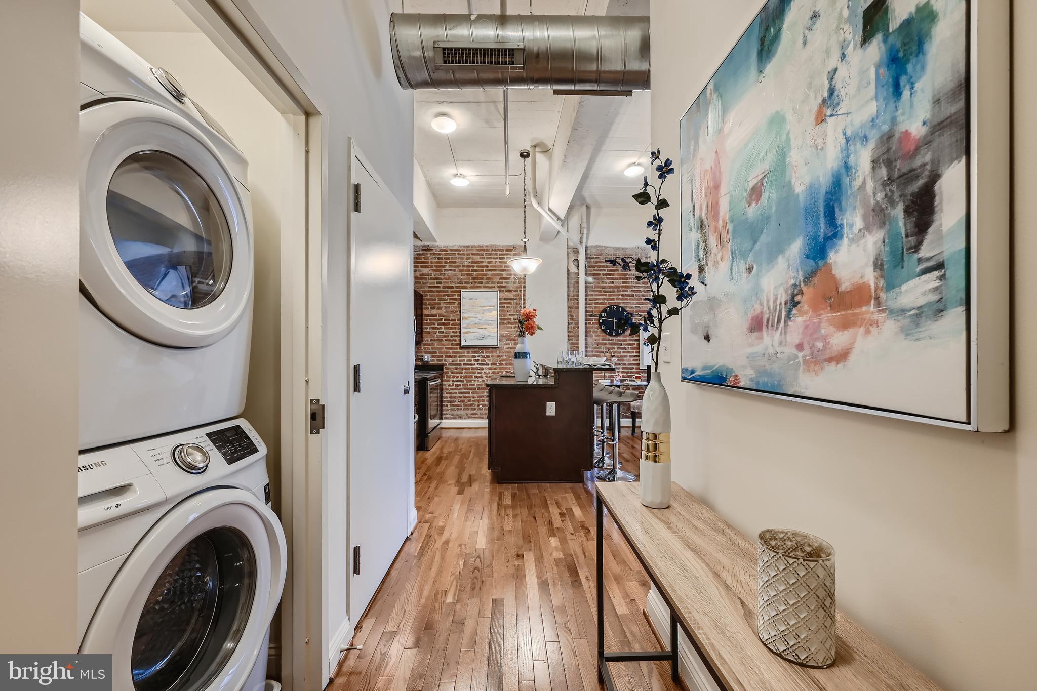 311 West Baltimore Street, Unit 503 Baltimore, MD 21201 - Photo 11 of 29 a view of a hallway with washer and dryer