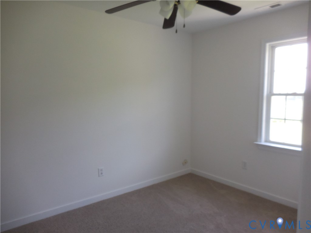 1781 Rolling Path Road Mineral, VA 23117 - Photo 11 of 23 Room featuring light beige carpet flooring, white