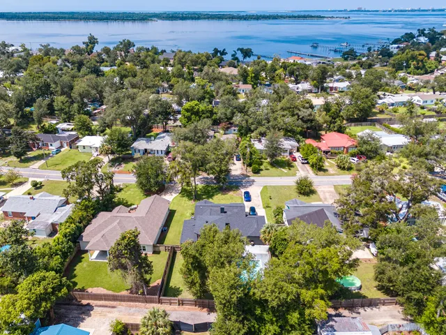 a kitchen with stainless steel appliances a stove top oven a sink a refrigerator and cabinets