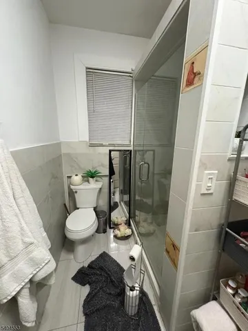 a kitchen with stainless steel appliances granite countertop a stove top oven a sink a counter space and cabinets