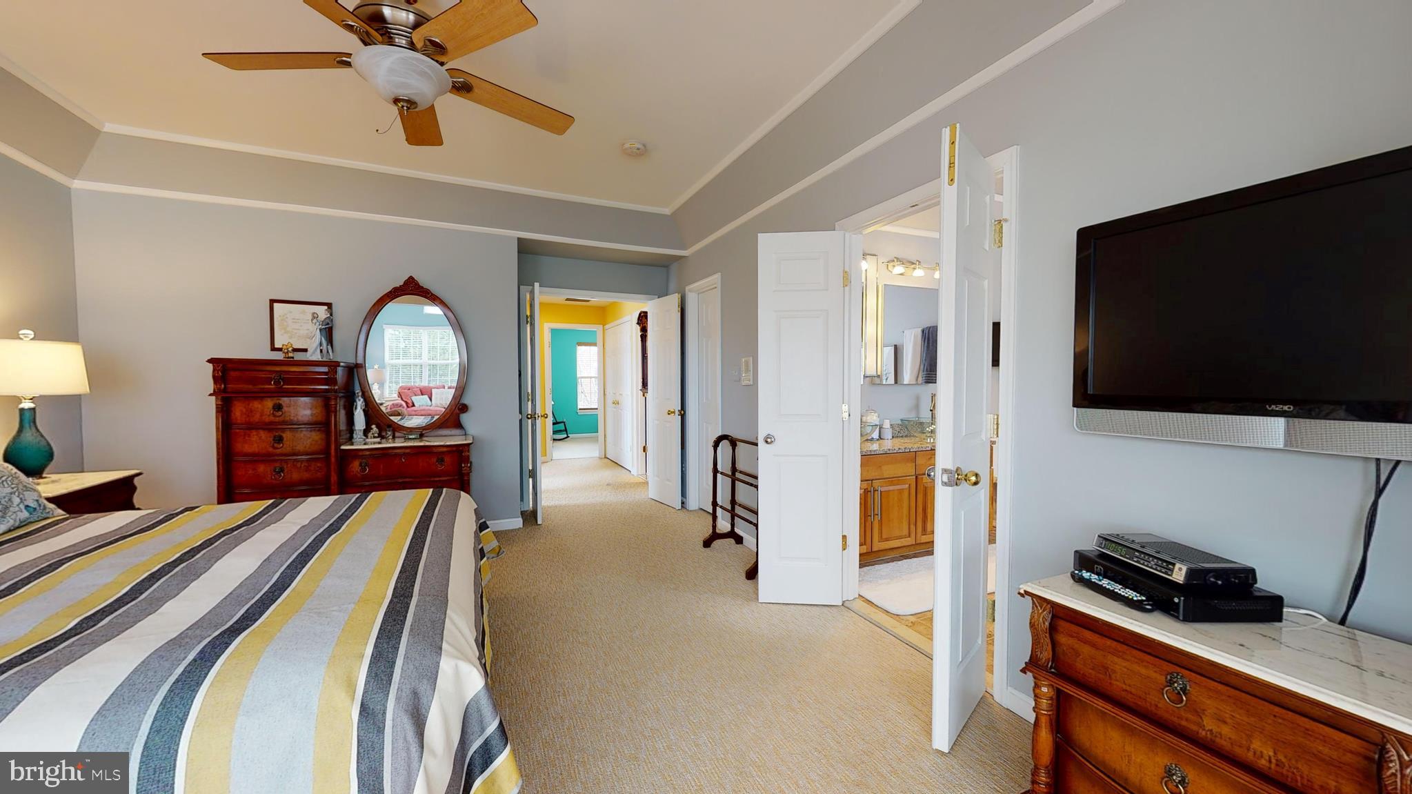 1880 Crescent Park Drive Reston, VA 20190 - Photo 27 of 51 a bedroom with furniture and a flat screen tv