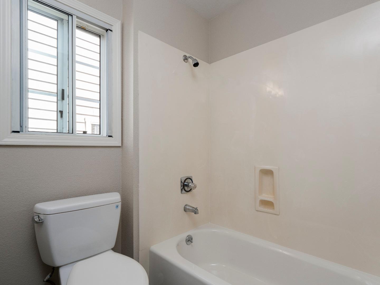 935 Old County Road, Unit 45 Belmont, CA 94002 - Photo 12 of 18 a white toilet sitting next to a bath tub