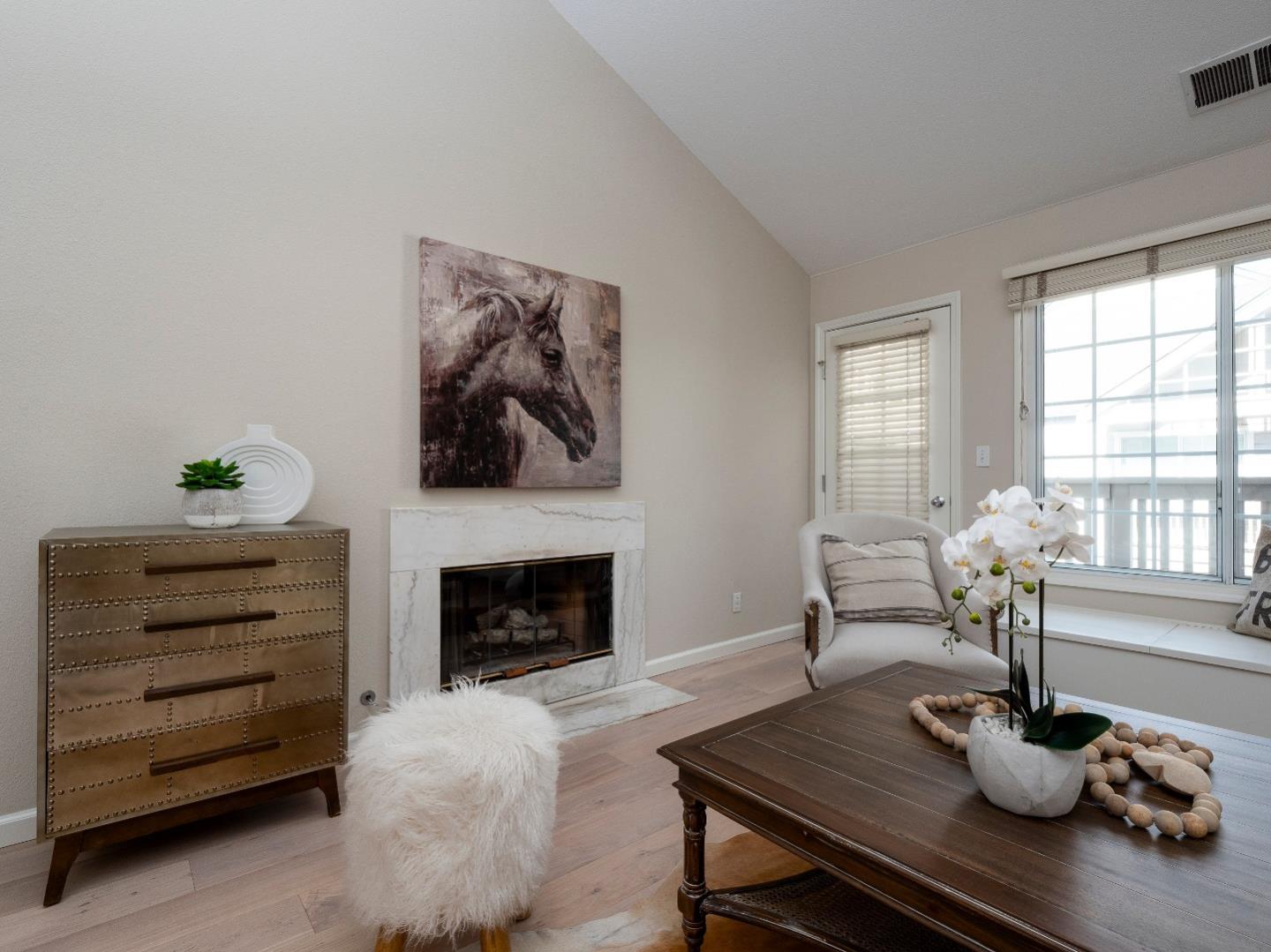 935 Old County Road, Unit 45 Belmont, CA 94002 - Photo 3 of 18 a living room with furniture a fireplace and a potted plant