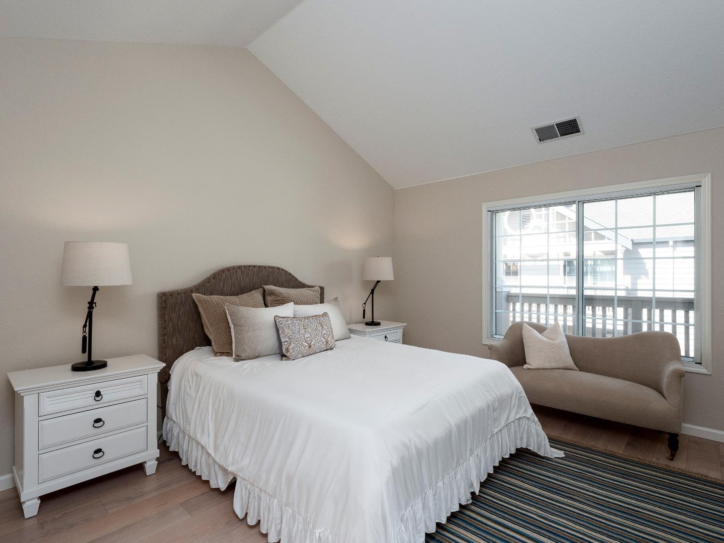 935 Old County Road, Unit 45 Belmont, CA 94002 - Photo 6 of 18 a bedroom with a bed and a window