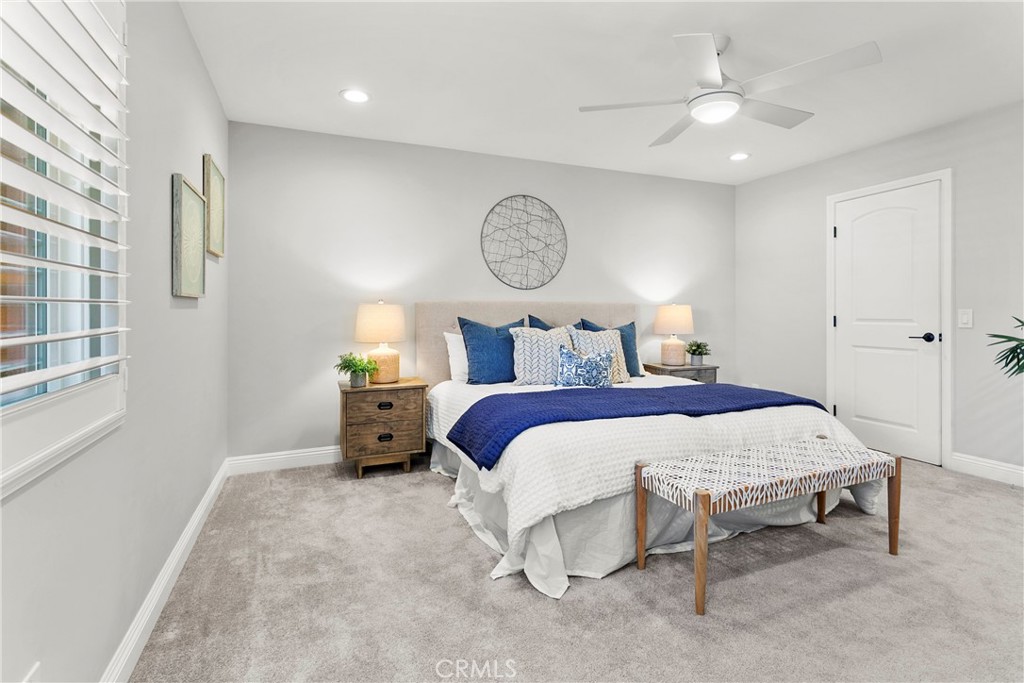 21066 Poolside Lane Huntington Beach, CA 92648 - Photo 12 of 31 a bedroom with a bed and a window