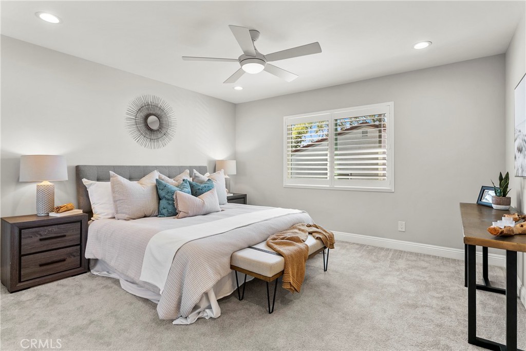 21066 Poolside Lane Huntington Beach, CA 92648 - Photo 15 of 31 a bedroom with a bed and a window