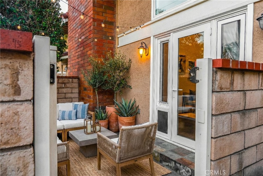 21066 Poolside Lane Huntington Beach, CA 92648 - Photo 22 of 31 a view of balcony and patio