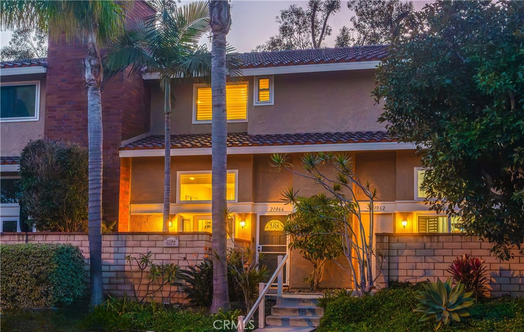 21066 Poolside Lane Huntington Beach, CA 92648 - Photo 23 of 31 a view of a house with a small yard