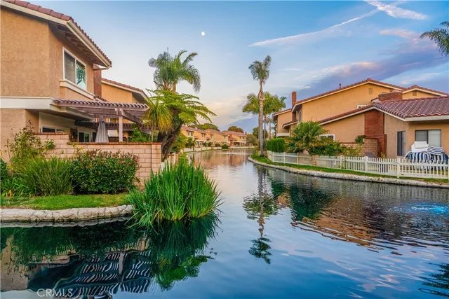 a view of a lake with a house next to a lake