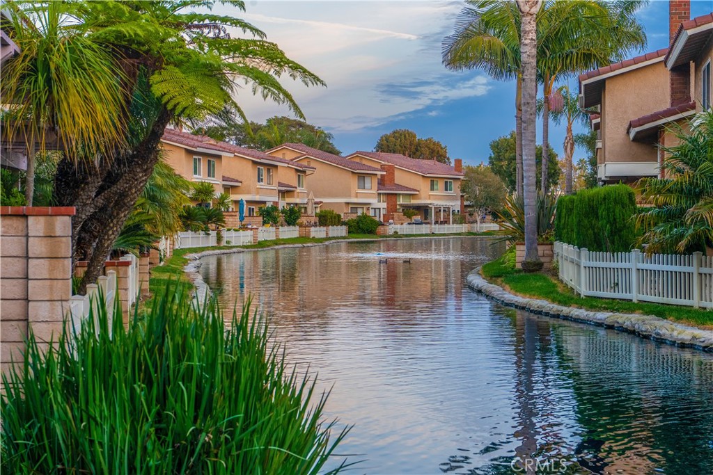 21066 Poolside Lane Huntington Beach, CA 92648 - Photo 31 of 31 a view of a lake with a house
