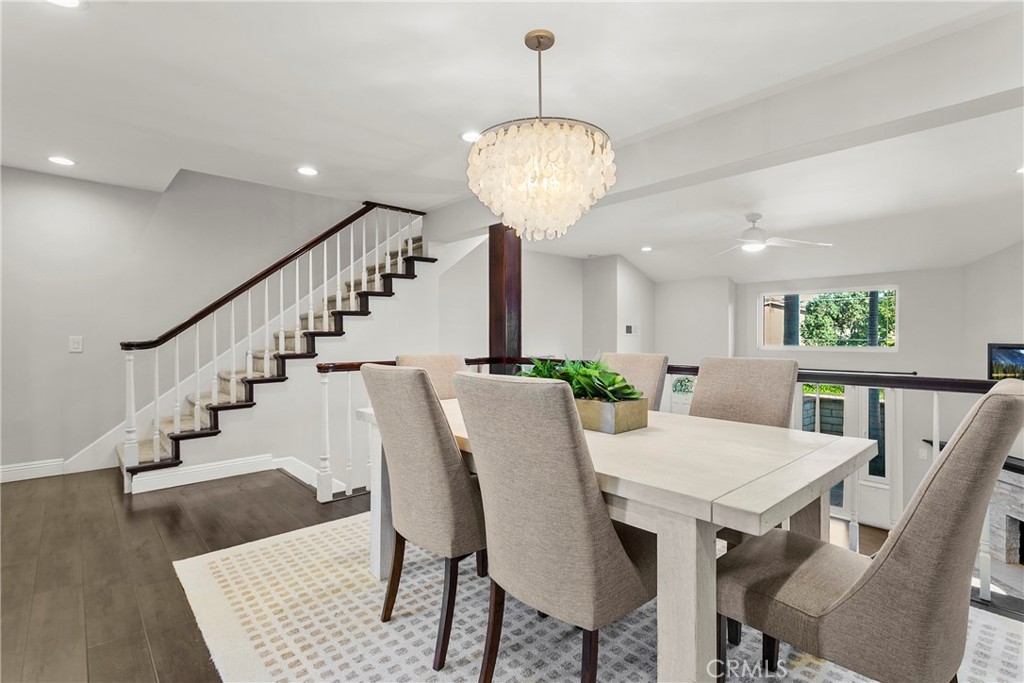 21066 Poolside Lane Huntington Beach, CA 92648 - Photo 4 of 31 a view of a dining room with furniture wooden floor and chandelier