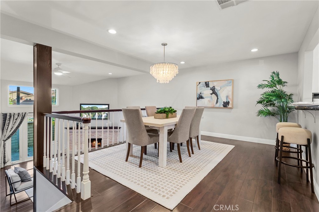 21066 Poolside Lane Huntington Beach, CA 92648 - Photo 5 of 31 a view of a dining room with furniture and wooden floor