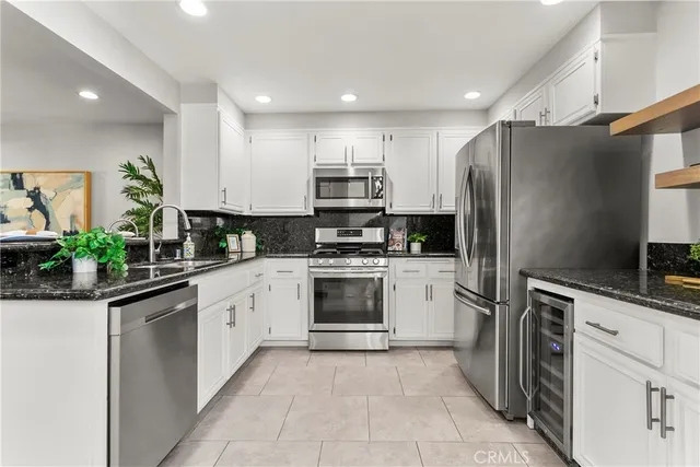 a kitchen with a refrigerator sink and microwave