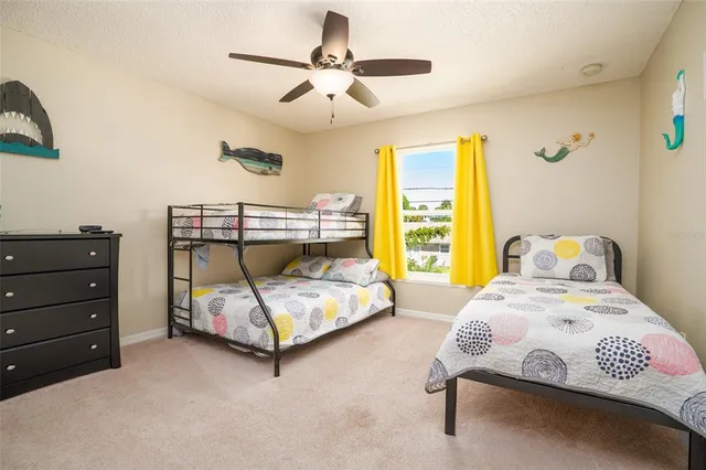 a bedroom with a bed a window and couch