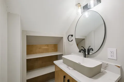 a bathroom with a sink and a mirror