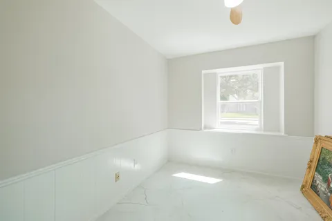a view of an entryway with wooden floor and staircase