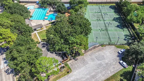 an aerial view of a house with a swimming pool